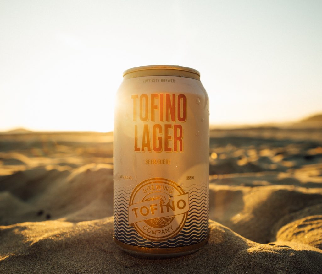 Sinking a cold beer from Tofino Brewing on the beach is the ultimate thing to do in Tofino in Summer