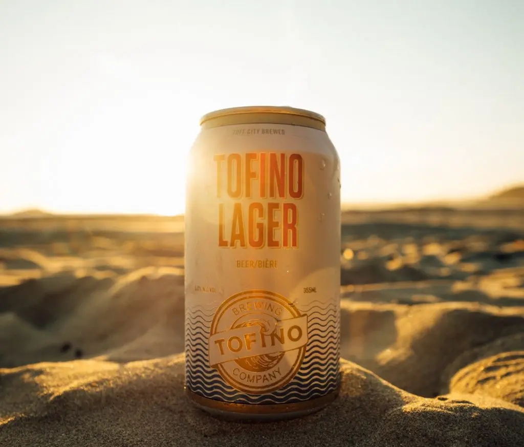 Sinking a cold beer from Tofino Brewing on the beach is the ultimate thing to do in Tofino in Summer