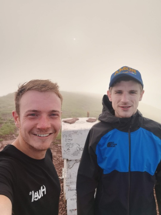 Iain the founder of The Road Trip Expert stood with his friend Adam at the highest point in Serbia.