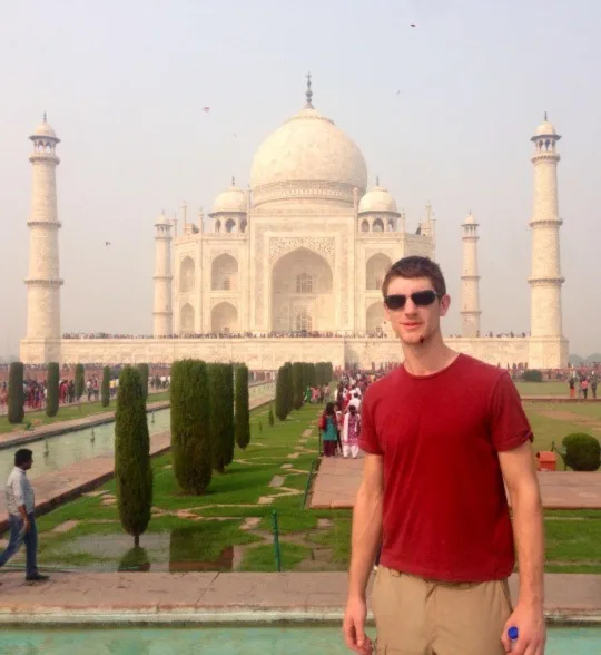 A photo of Iain stood in front of the Taj Mahal