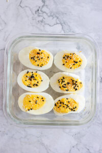 deviled eggs in storage container.