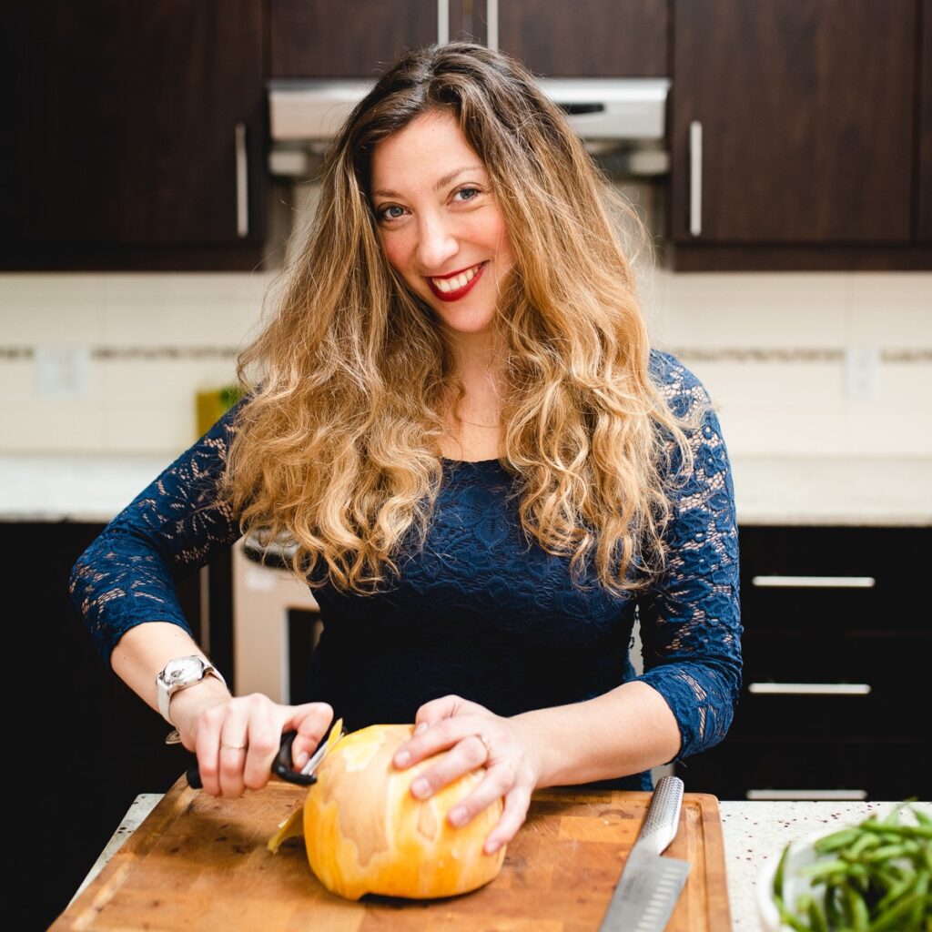 Ksenia Prints, Author at The Road Trip Expert, in the kitchen peeling vegetables