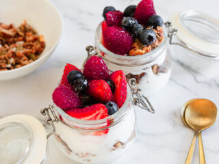 side view of two Make-Ahead Berry Yogurt Parfait With Granola.
