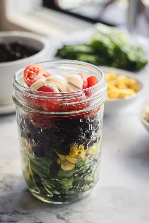 Mexican taco salad in a jar without lid.