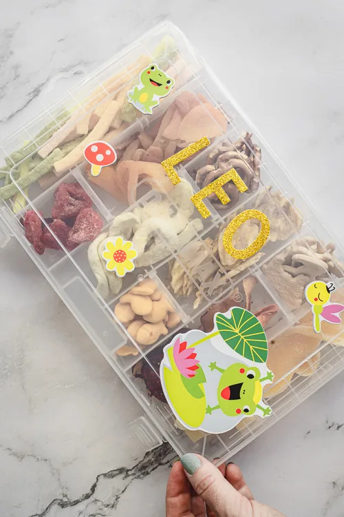 Travel snackle box for kids, closed and personalized.
