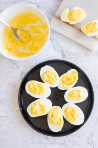 Filling the egg white halves with the yolk mixture