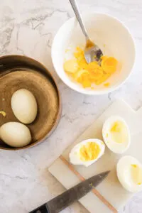 Eggs that have been peeled and sliced in half lengthwise