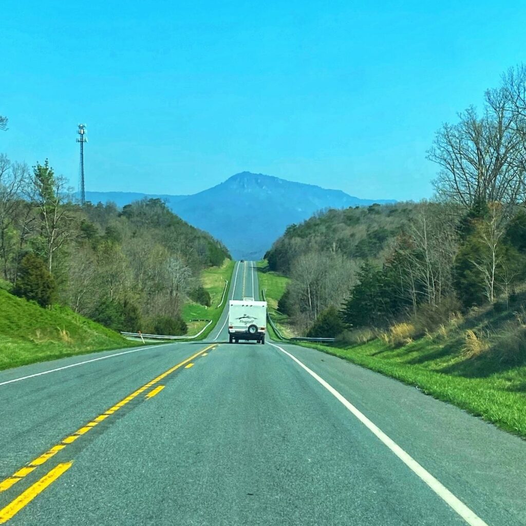 A photo of the open road with a caravan in front of us during our road trip