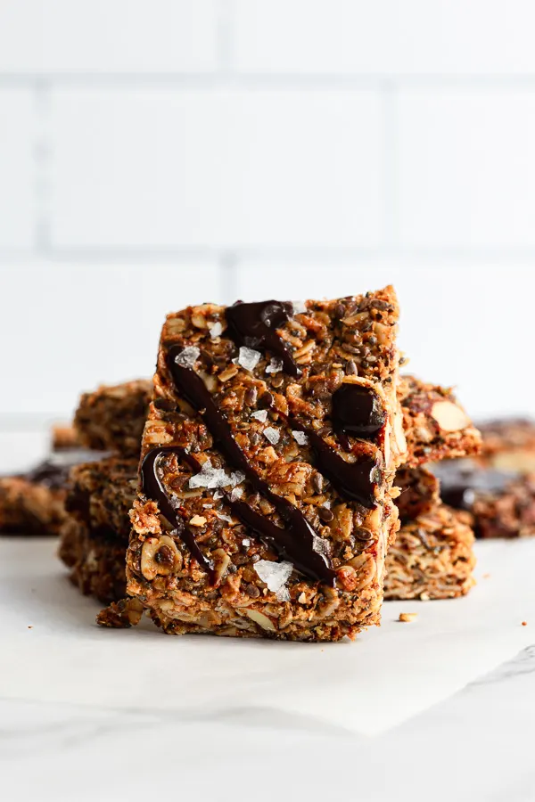 homemade granola bars drizzled in melted chocolate